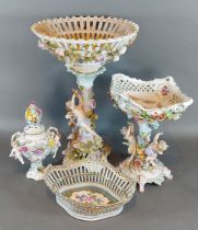 A German porcelain comport of figural and foliate encrusted form together with another comport, a