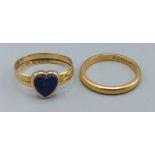 A 22ct gold band ring set with a blue stone in the form of a heart together with a 22ct gold wedding