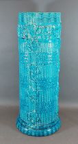 A Burmantofts blue glazed stick stand of stylised form, 57cms tall