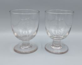 A pair of 19th Century glass rummers, each with engraved initals, 14cms tall