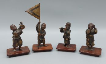 Miyao Eisuke a set of four Meiji patinated bronze and gilded small figures, three in the form of