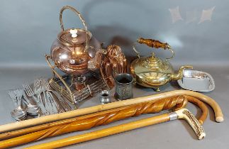 A copper jelly mould together with other metal wares to include two kettles and other items