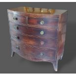 A 19th century mahogany bow fronted chest of two short and three long drawers with brass knob