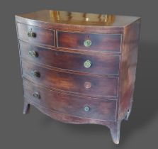 A 19th century mahogany bow fronted chest of two short and three long drawers with brass knob