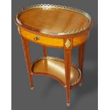 A French inlaid and gilt metal mounted oval side table, the brass gallery top above a frieze
