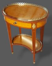 A French inlaid and gilt metal mounted oval side table, the brass gallery top above a frieze