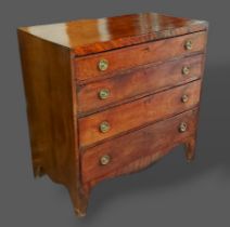 A 19th Century mahogany straight front chest of four long drawers with circular brass handles raised