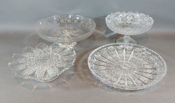 An etched glass and silver plated comport together with two other glass comports and a cut glass