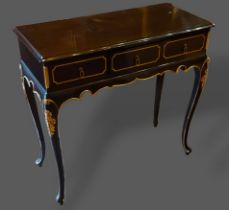 A 20th Century serving table, with three drawers above a shaped frieze raised upon cabriole legs,