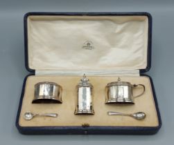 A Birmingham silver three piece cruet set by Mappin and Webb within original fitted box, 4ozs