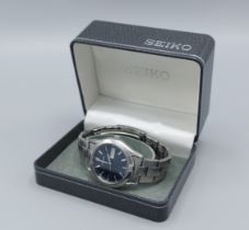 A Seiko stainless steel cased gentlemans wristwatch with stainless steel strap and within original