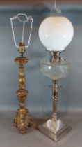 A silver plated oil lamp with cut glass well, glass chimney and opaque glass shade together with