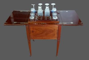 An Edwardian mahogany satinwood crossbanded rise and fall drinks cabinet, the double hinged top