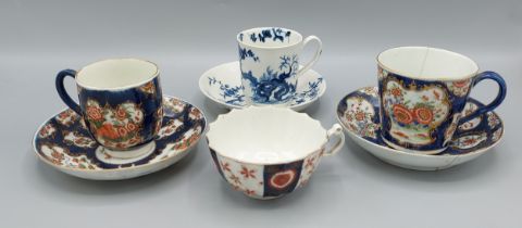 A First period Worcester cup and saucer together with two similar first period Worcester cups and