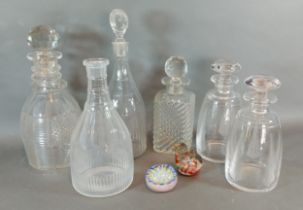 A collection of six glass decanters together with two glass paperweights