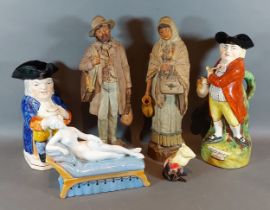 A Staffordshire Toby jug, Hearty Good Fellow, together with another similar, a pair of figures, a