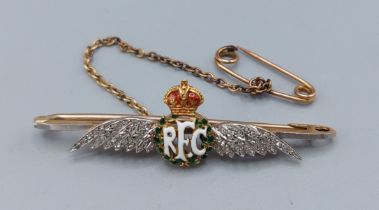 A 15ct gold RFC bar brooch in the form of wings set with diamonds and enamel, 5.3gms