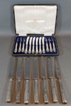 A set of six dessert knives and forks with silver handles within fitted case together with a set