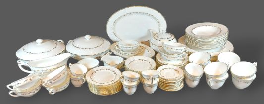 A Royal Worcester Chantilly pattern dinner service comprising dinner plates, tureens, coffee and tea