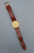 An 18ct gold cased gentleman's wristwatch by Garrard, 3.2cm diameter, 23.7gms including movement