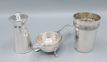 A Birmingham silver tea strainer together with an 800 mark beaker and a Birmingham silver pepper