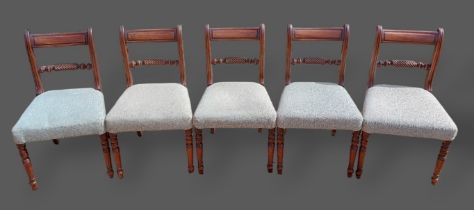 A set of five Regency mahogany dining chairs, each with a rope twist back above a padded seat raised