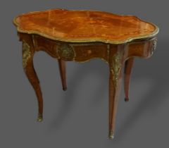 A French marquetry inlaid and gilt metal mounted centre table, the shaped top above a frieze
