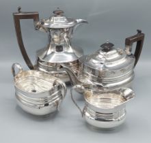 A George v silver four piece tea service comprising teapot, hot water pot, cream jug and sucrier,