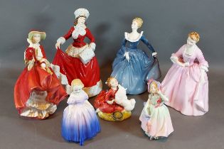 A Royal Doulton figurine A Hostess of Williamsburg HN 2209, together with six other Royal Doulton