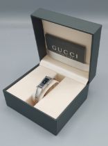 A Gucci 1500L stainless steel cased ladies wristwatch with original box