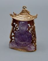 A 9ct gold pendant set with carved amethyst in the from of Buddha, 2.5cms by 4cms, 13.3gms