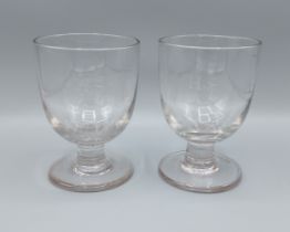 A pair of 19th Century glass rummers, each with engraved initials, 14cms tall