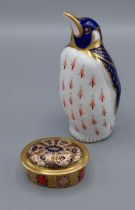 A Royal Crown Derby Emperor Penguin paperweight with gold stopper, together with a Royal Crown Derby