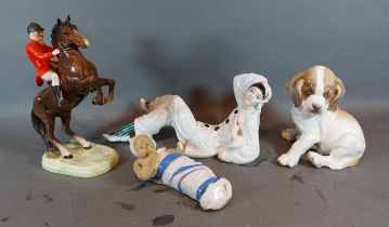 A Beswick model in the form of a rearing horse and rider together with a Rosenthal reclining figure,
