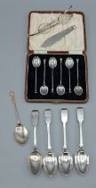 A pair of silver spectacles together with a cased set of silver coffee spoons, five silver teaspoons