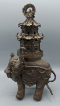 A Chinese bronze incense burner in the form of a elephant with pagoda, 30cms tall