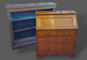 An oak dwarf bookcase, the moulded top above open shelves, 128cms wide, 35cms deep and 113cms tall