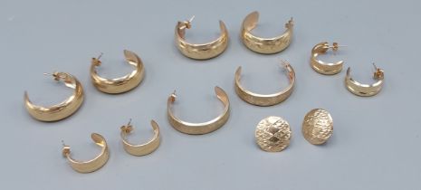 A pair of 9ct gold earrings, together with four similar pairs of earrings and a pair of 9ct gold ear