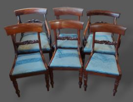 A set of four William IV mahogany dining chairs together with a pair of similar armchairs