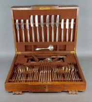 A silver plated canteen of cutlery by Elkington within oak and walnut case together with a