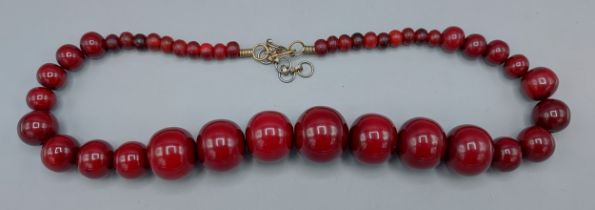 A Cherry Amber graduated bead necklace, 105gms