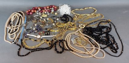 A collection of jewellery to include necklaces, brooches and other items