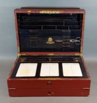 An early 20th Century leather bound writing box, the hinged cover enclosing a fitted interior by