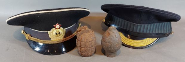 A Welsh Guards military cap, together with another similar cap and two hand grenades