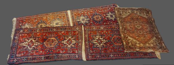 A pair of Northwest Persian woollen rugs together with another similar