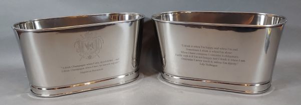 A pair of Champagne coolers, each bearing Bollinger inscription, 30cms x 14cms