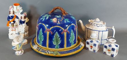 A Majolica cheese dome and stand together with other ceramics to include a salt glazed teapot