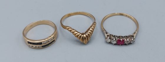 A 9ct gold band ring set blue and clear stones together with two other 9ct gold dress rings, 6gms