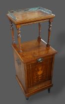 An Edwardian Rosewood and marquetry inlaid side cabinet with a brass galleried top above a fall