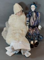 A bisque porcelain headed doll by Joyce Wolf, together with an Art Deco style doll